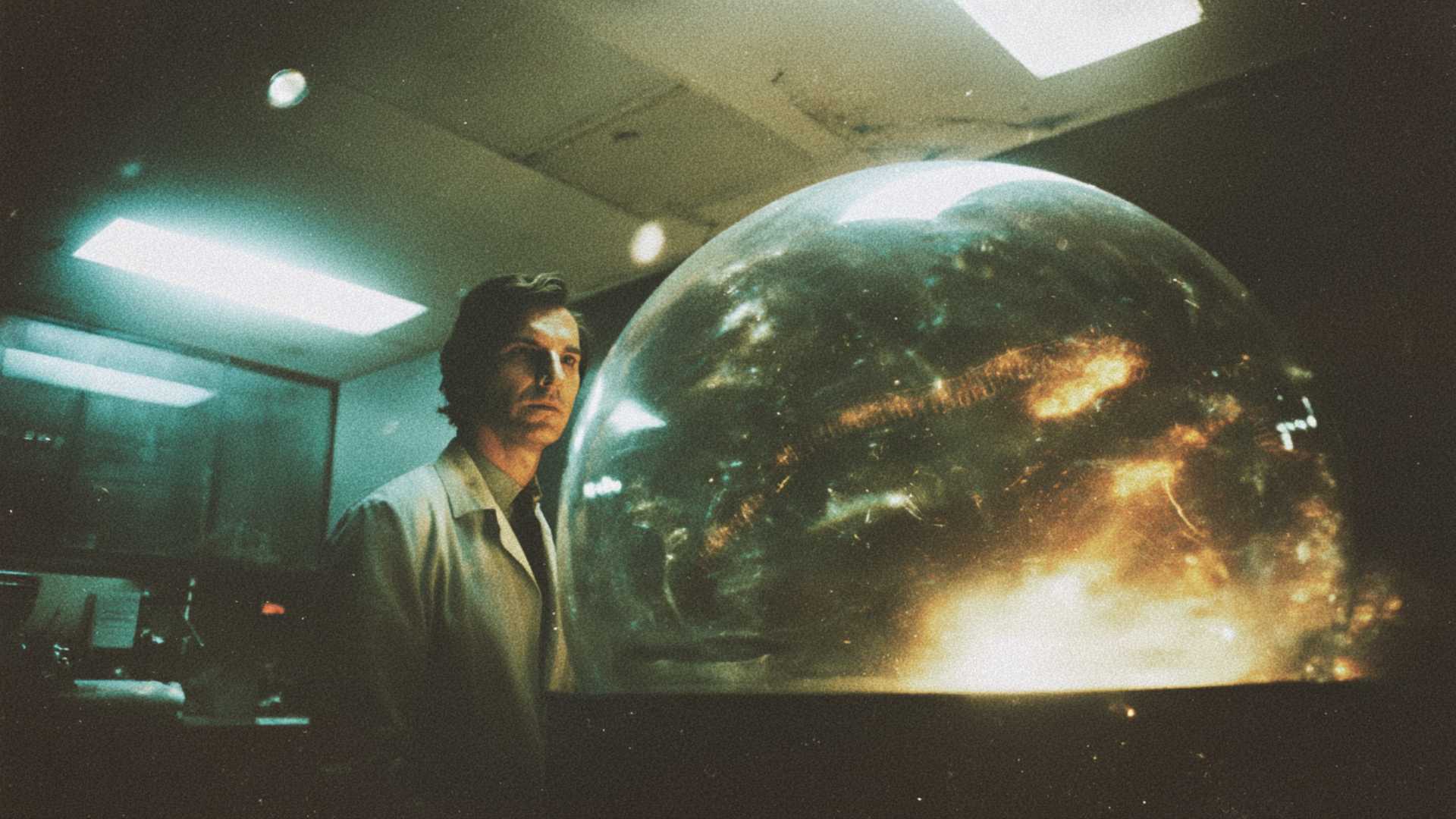 A scientist observes a luminous cellular structure.